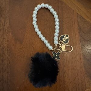 Pearl Beaded Bag Charm with Black Pom and Charms